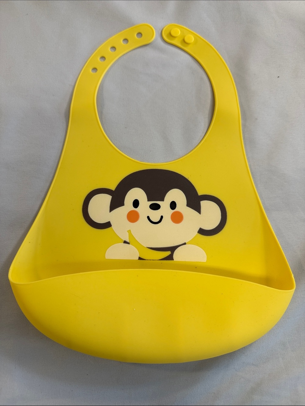 NWOT - Yellow Silicone Baby Bib with Monkey Pocket